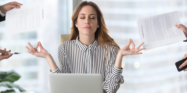Calm,Female,Executive,Meditating,Taking,Break,At,Work,For,Mental
